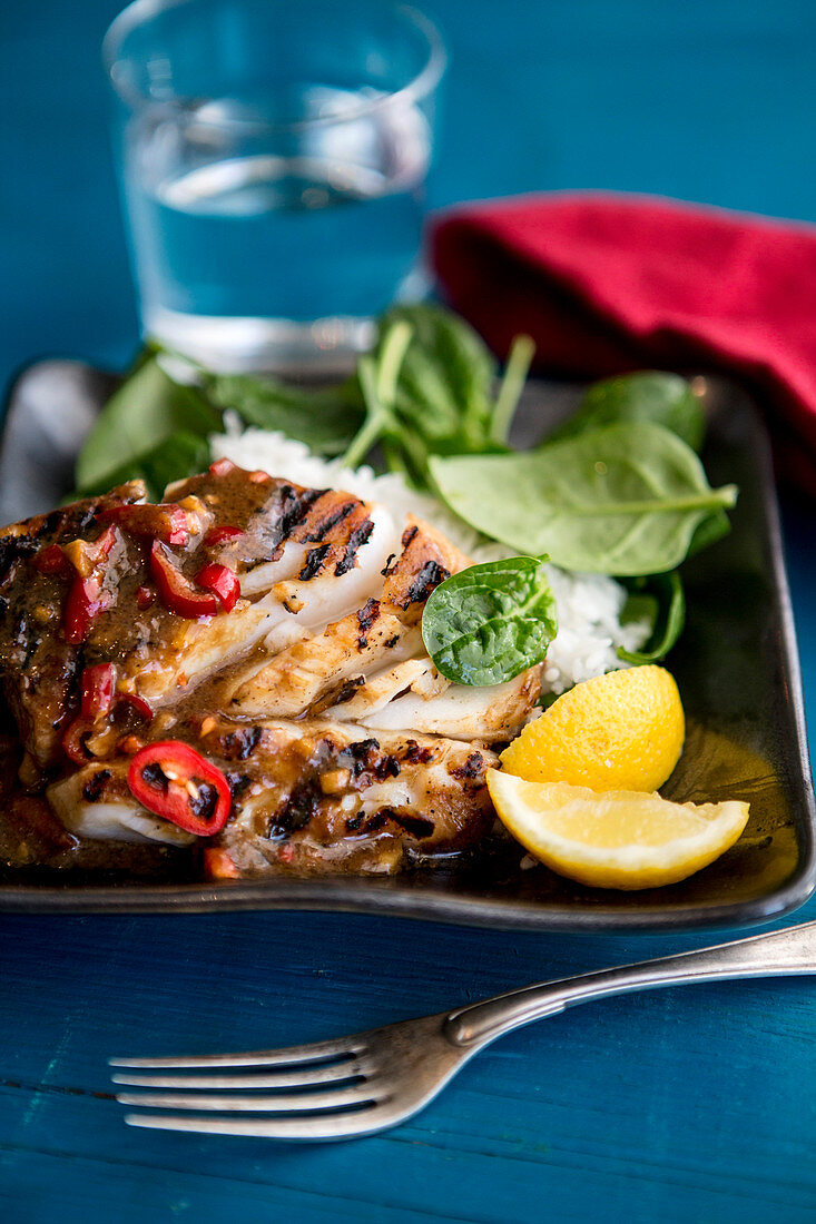 Grilled fish with a miso marinade and spinach salad