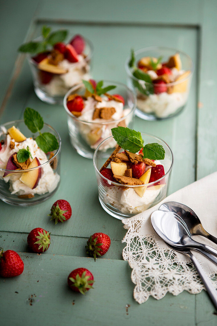 Strawberries and nectarines with mascarpone cream in glasses