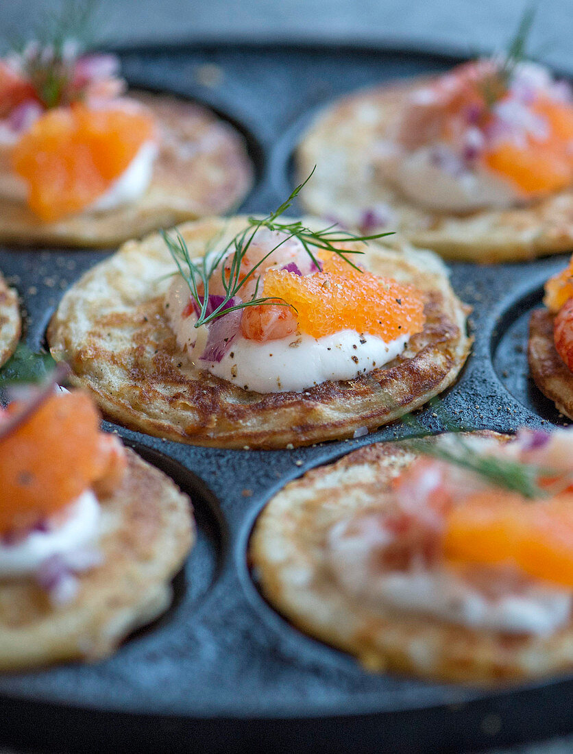 Blinis with Västerbotten cheese, prawns and caviar