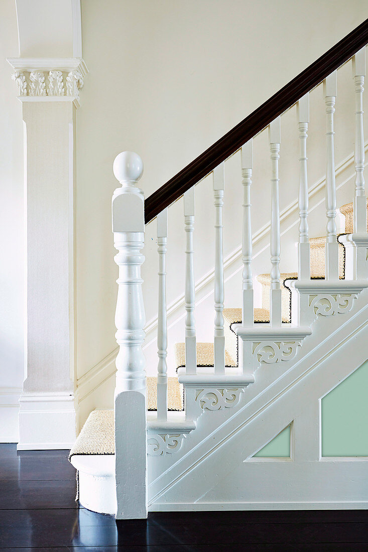 Artfully ornate handrail of a classic staircase