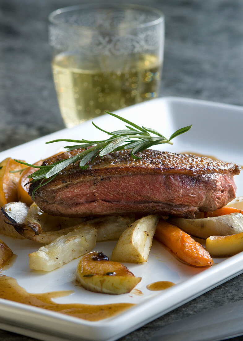 Duck breast with root vegetables, apples and cider gravy