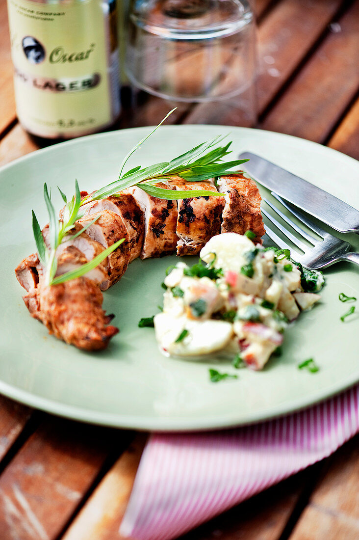 Pork fillet marinated in whiskey served with potato salad