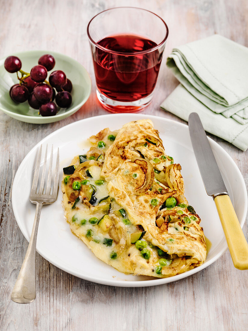 Pea vegetable and herb omelette with grape juice