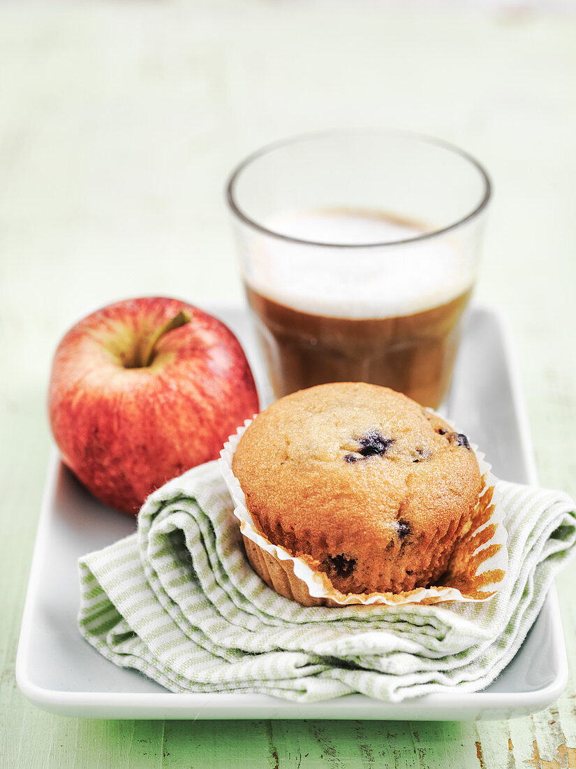 Blueberry muffin with apple and latte coffee