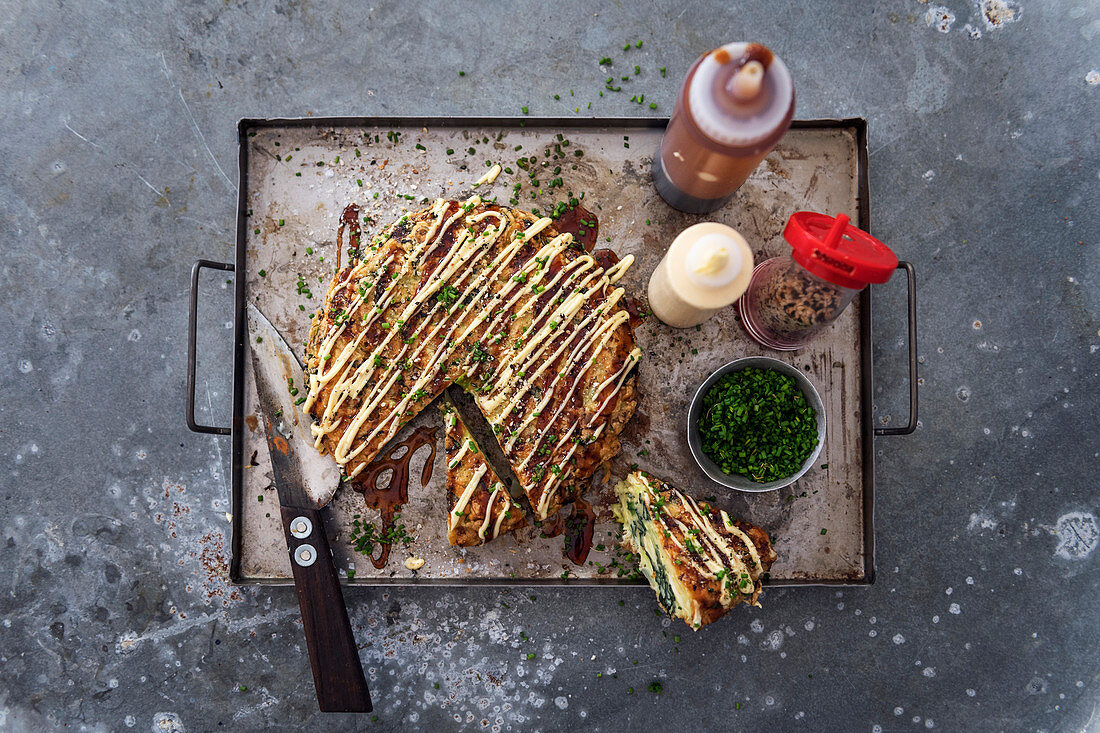 Okonomiyaki (spicy pancakes with cabbage, Japan)