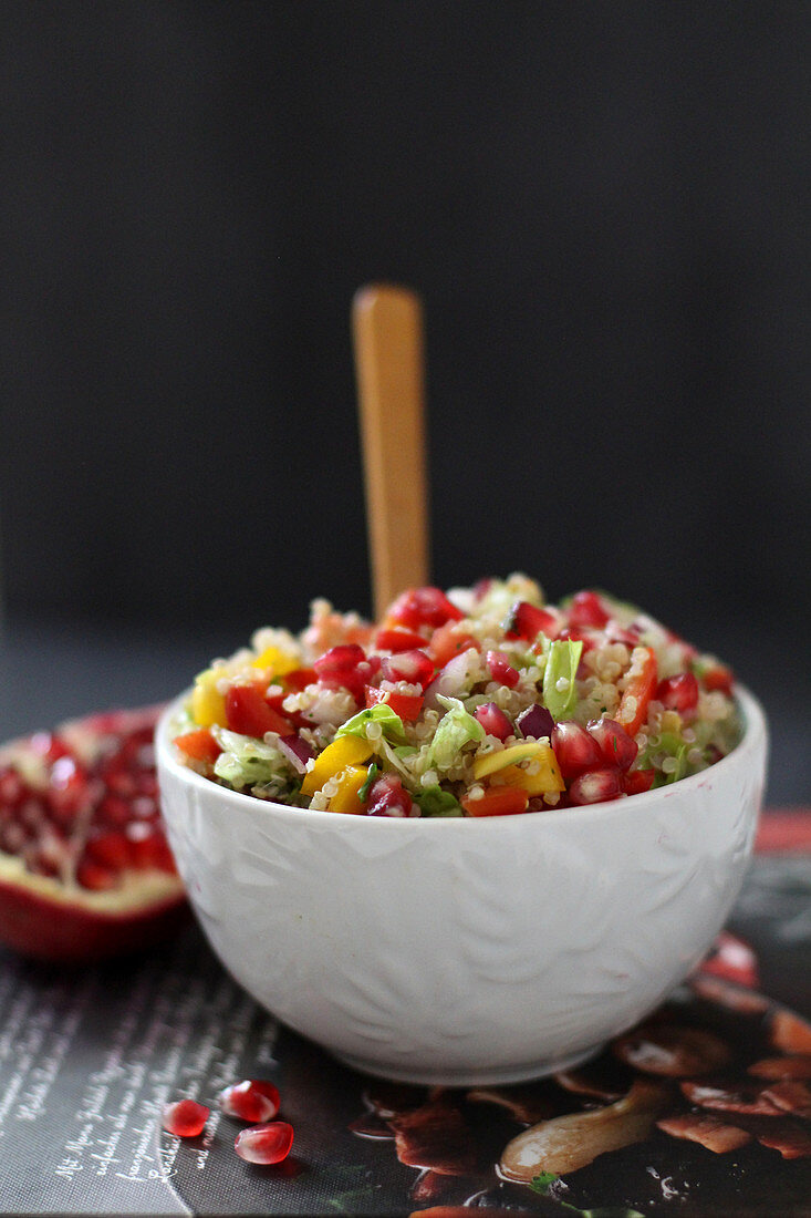 Oriental couscous salad with peppers and pomegranate seeds