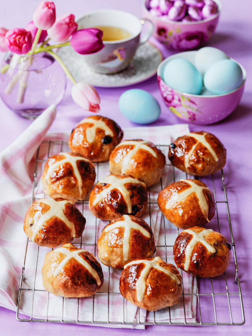 Easter breakfast hot cross buns with blue eggs