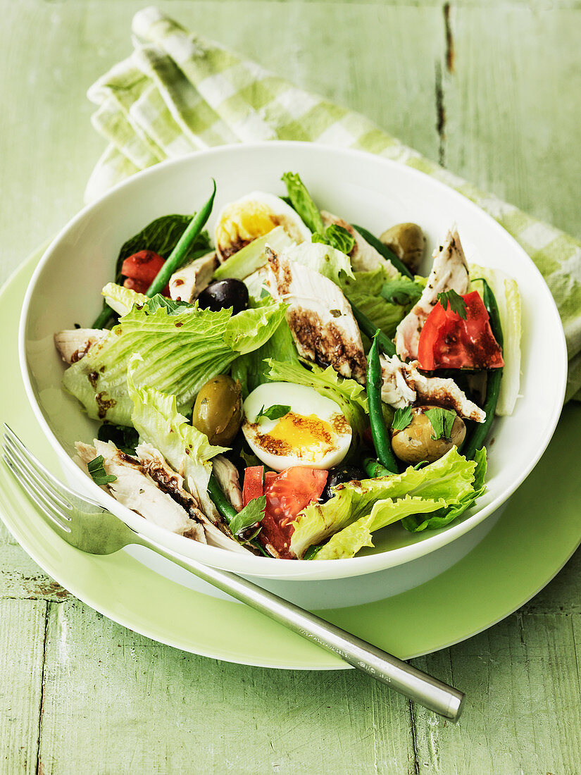 Chicken Salad Nicoise withj eggs, olives, beans and tomatoes