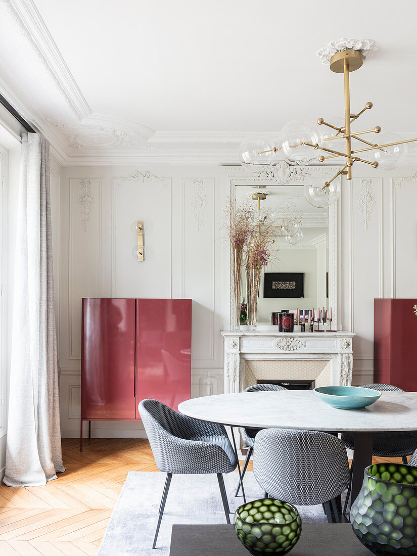 Modern furniture in dining room with stucco ceiling and walls