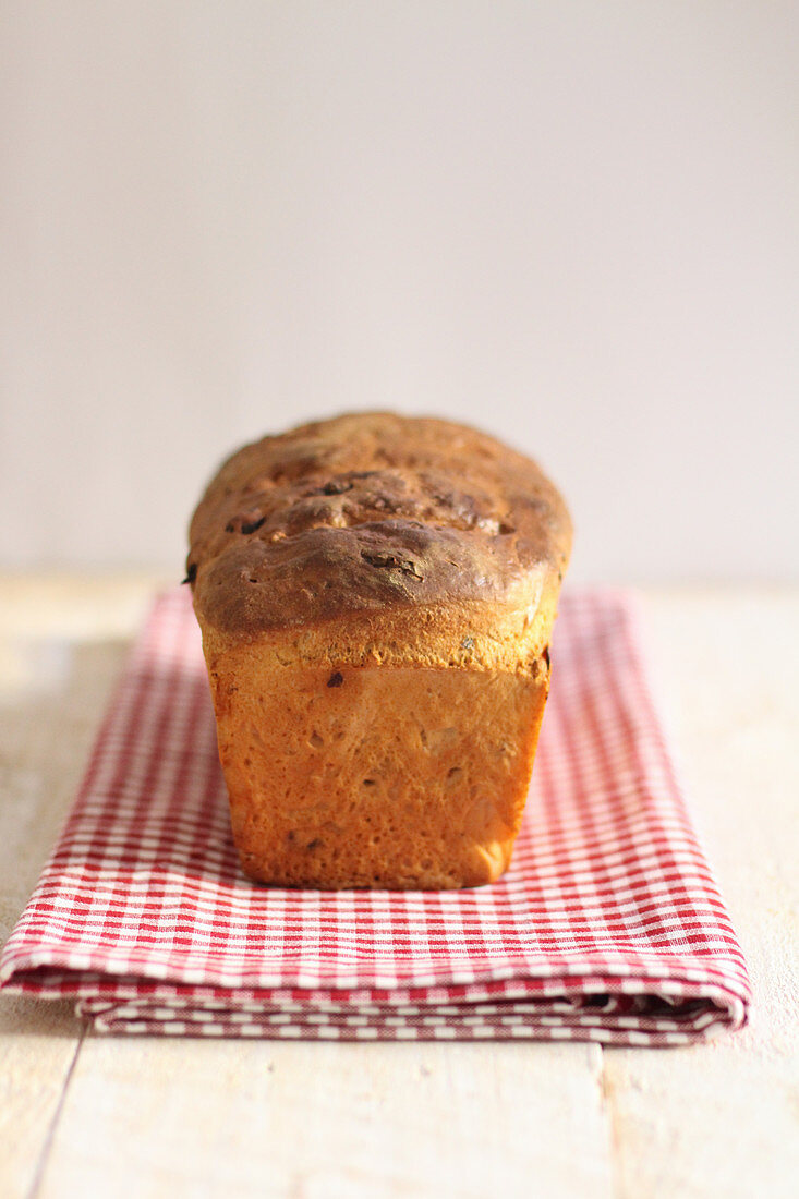 A loaf of bread on a tea towel