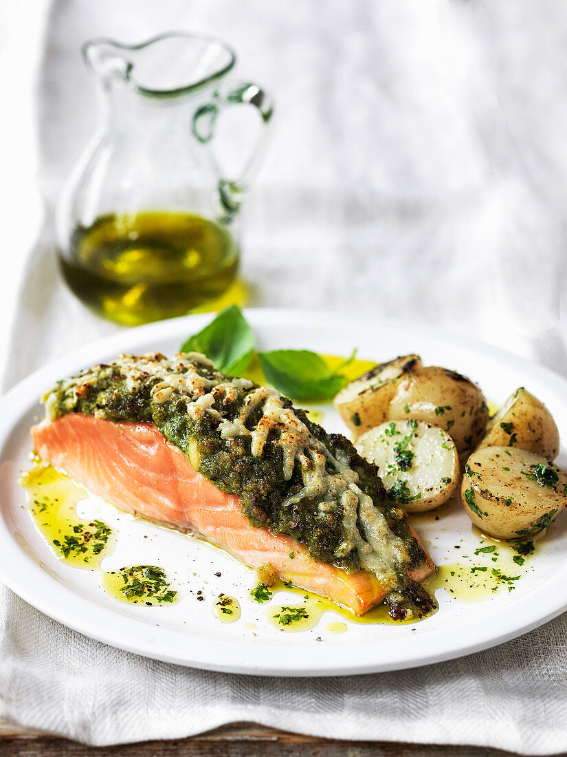 Salmon fillet with crusted pecorino pesto topping with olive oil