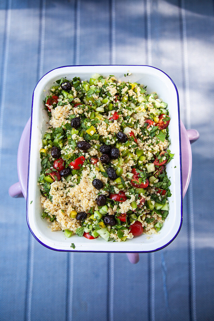 Bulgur salad with dried black olives and herbs