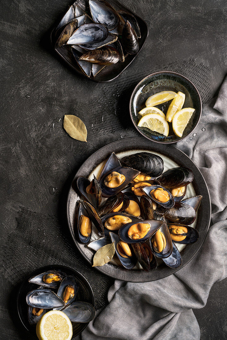 Fresh baked mussels served with lemon