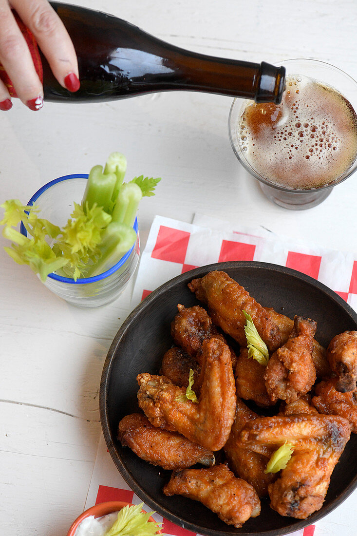 Spicy buffalo chicken wings with beer