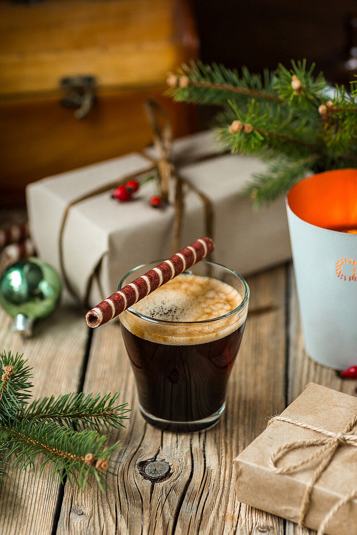 Cup of coffee with traditional roll tube pastry