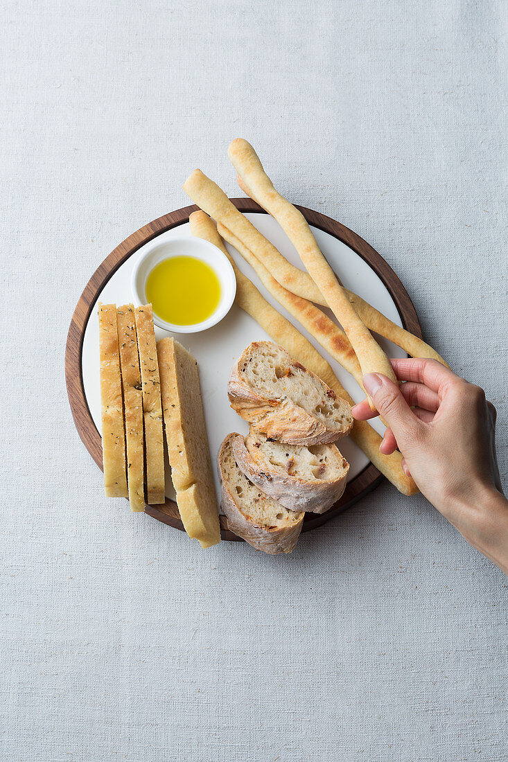 A trio of no-knead bread: cornbread, tomato baguette and grissini