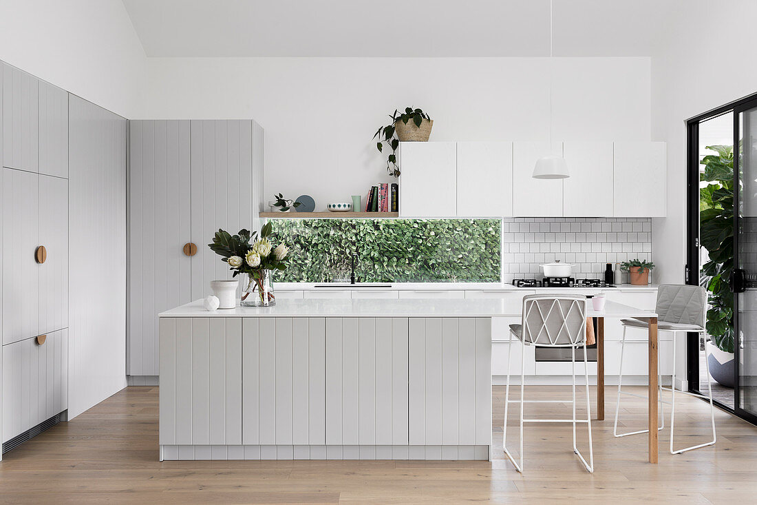 Modern country kitchen in light gray with a horizontal window