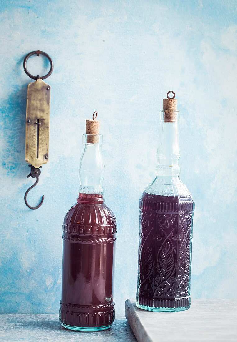 Two bottles of homemade cranberry juice