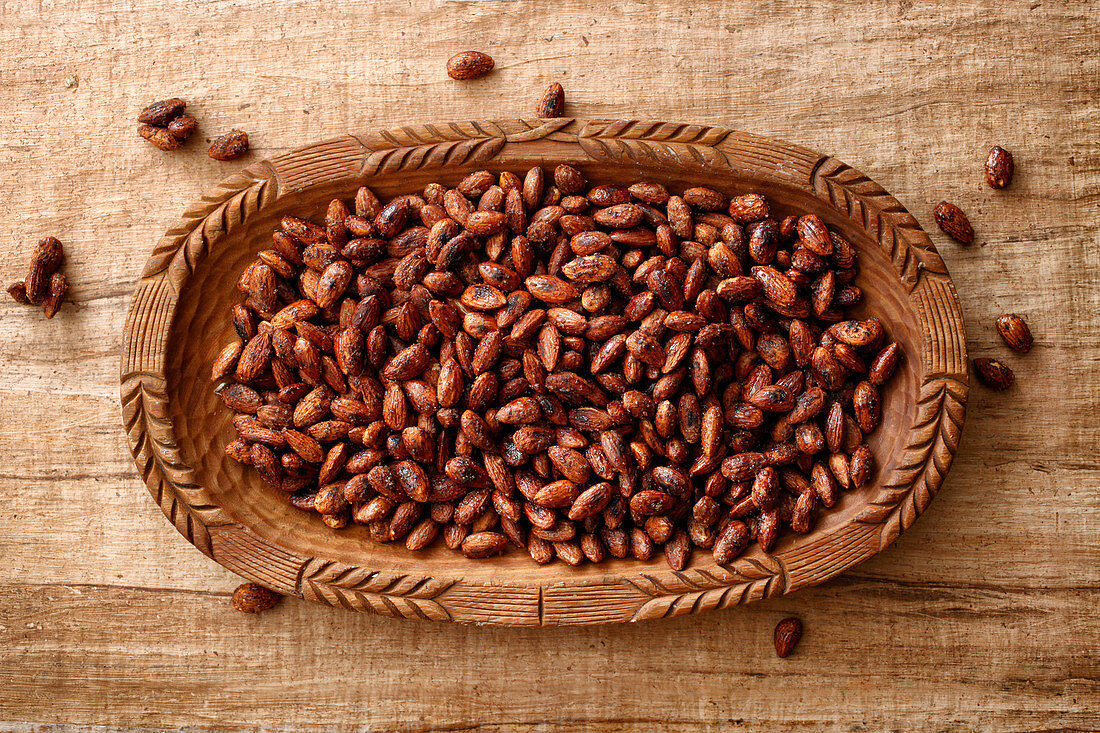 Roasted almonds in a wooden bowl