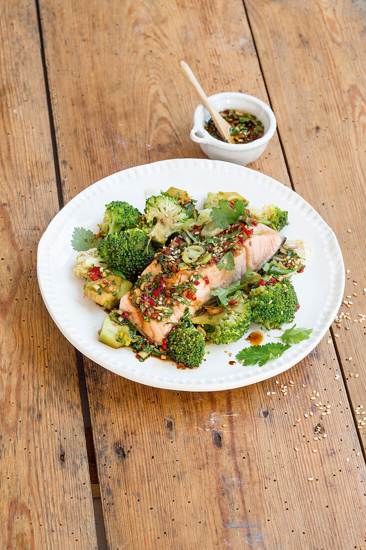Steamed salmon fillet with oriental broccoli and sesame seeds