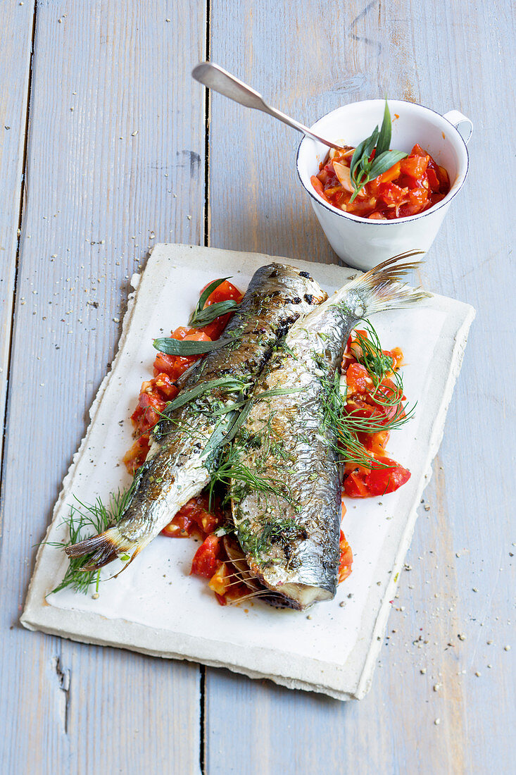 Grilled herb herring with an almond and tomato salsa