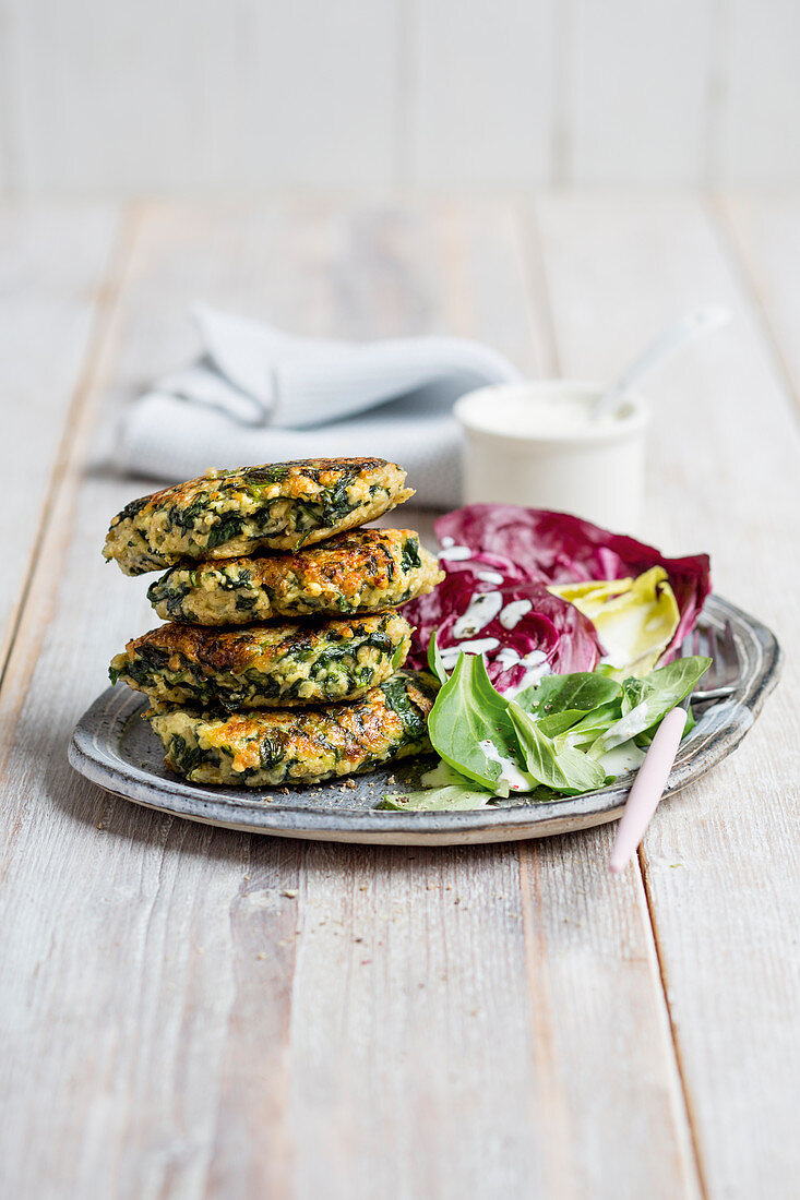 Spinach fritters with a mixed leaf salad