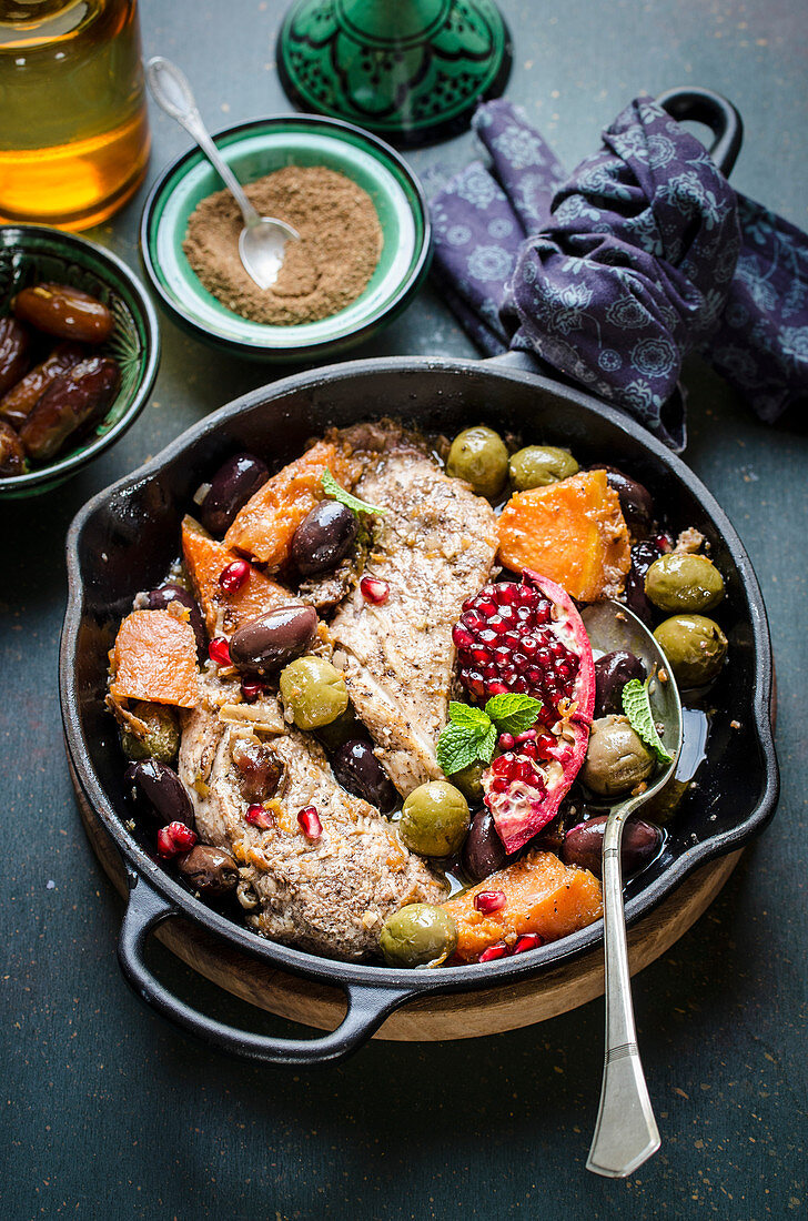 Chicken and pumpkin tagine with olives and pomegranade