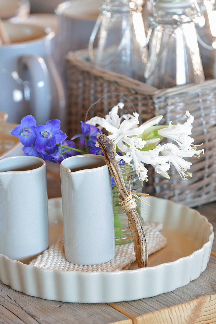 Summery arrangement of flowers and driftwood