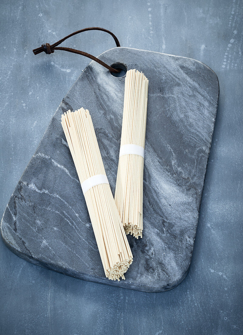 Ramen noodles on a grey marble board