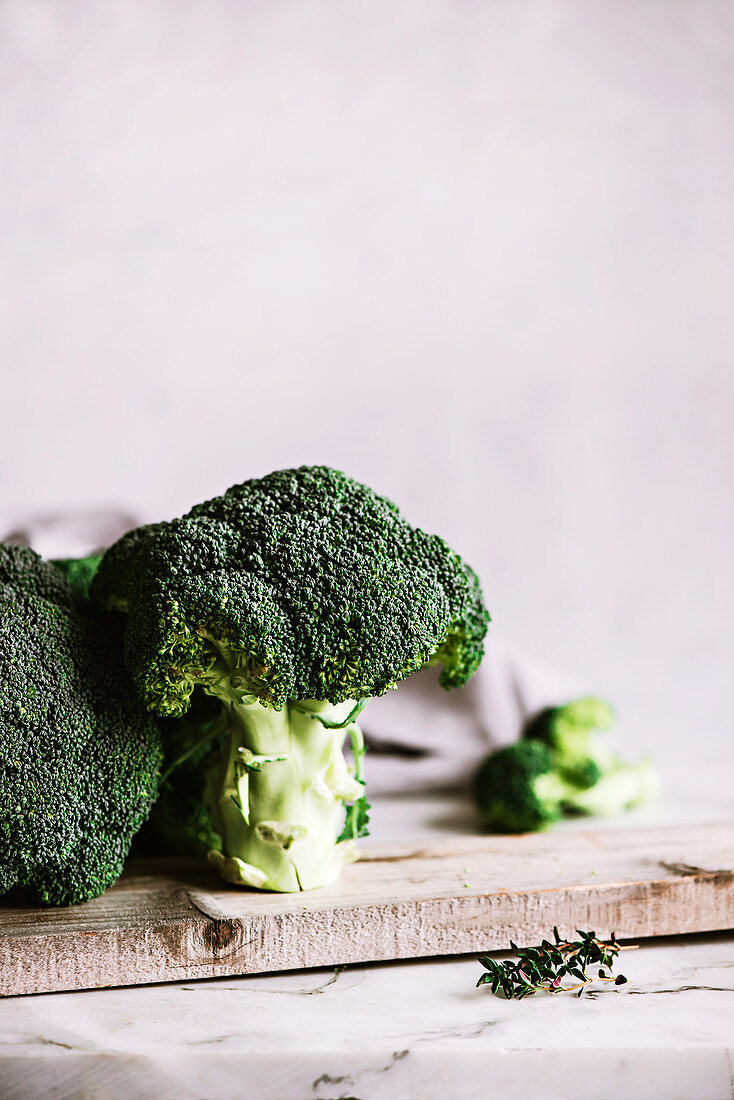 Broccoli trees on wood piece