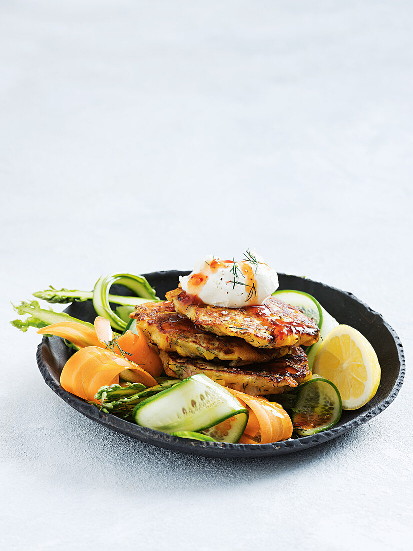 Corn and pancetta fritters with vegie ribbon salad