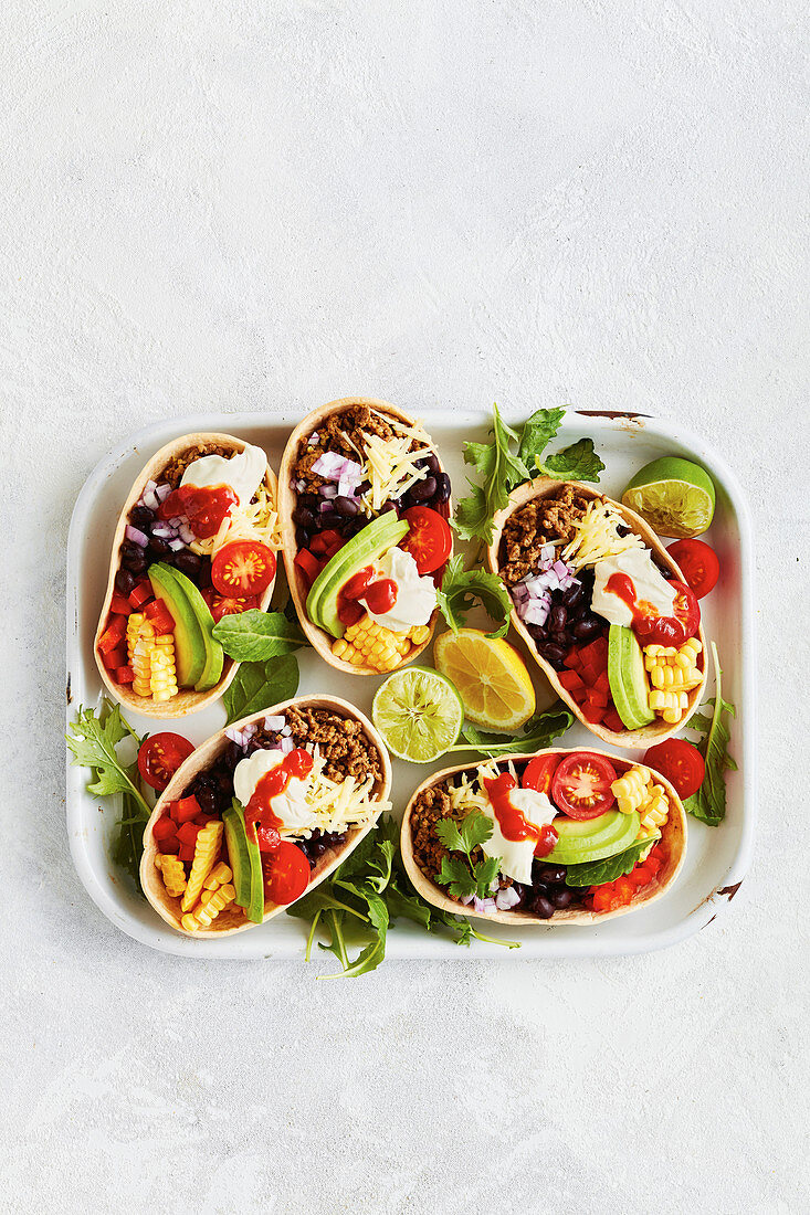 Taco shells with minced meat and vegetables