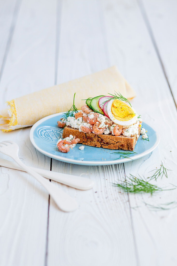 Gluten-free crab and radish bread with an egg