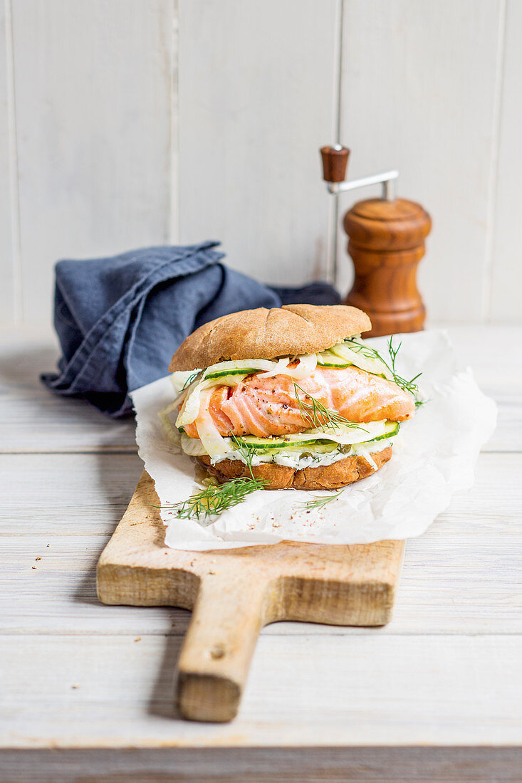 A salmon burger with cream cheese, fennel and capers