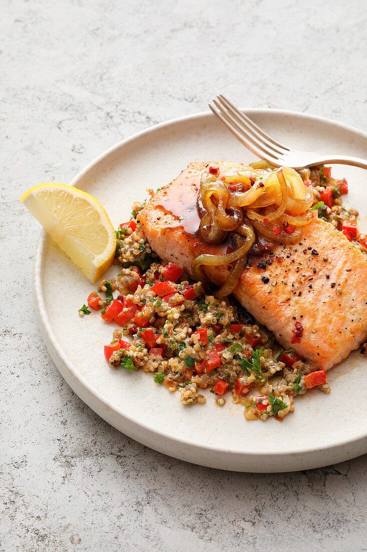 Salmon fillet with quinoa, chia, peppers, and sweet onion sauce