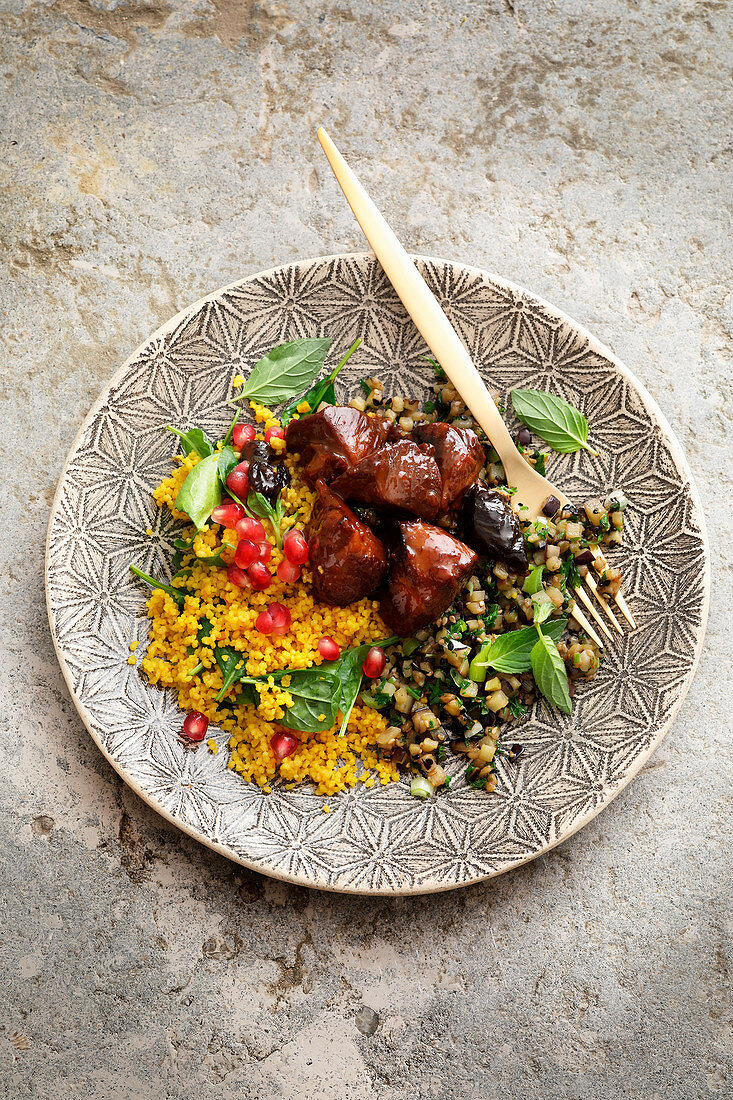 Lamb curry with spinach couscous and aubergine ragout