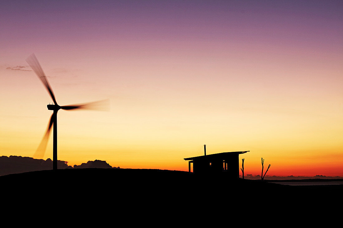 Pinwheel and hut at sunset