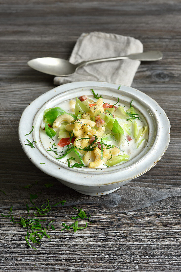 One pot stew with savoy cabbage, bacon and cheese