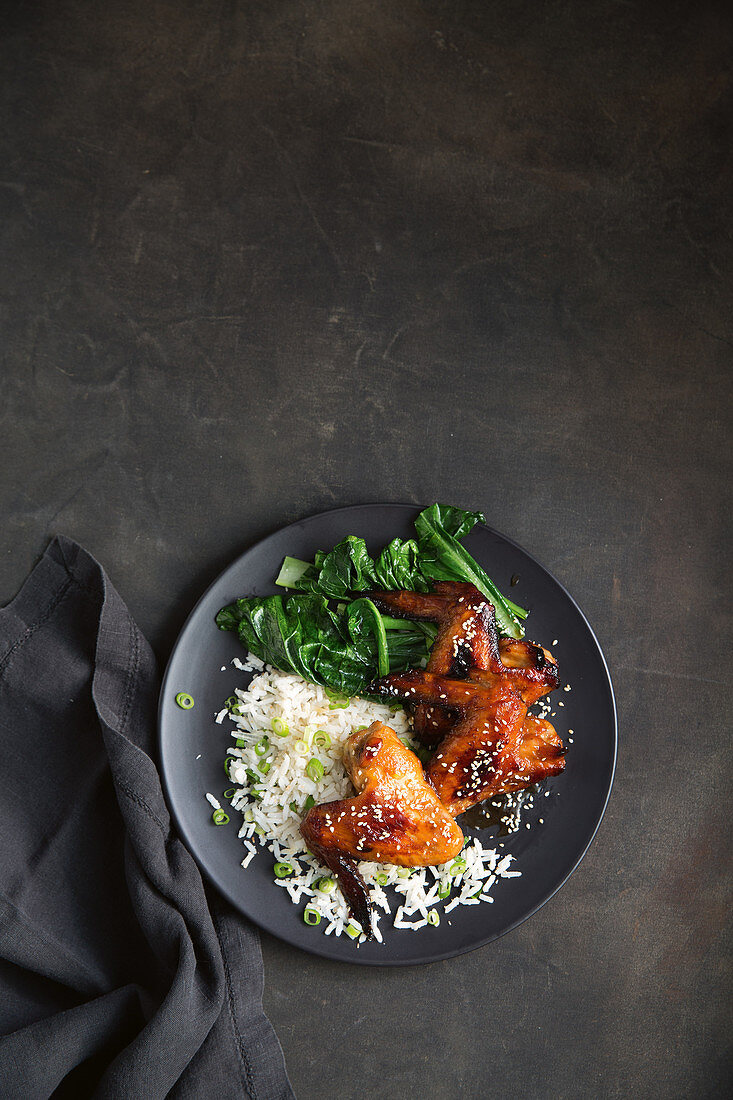 Sticky chicken wings with miso, ginger, paksoi and rice