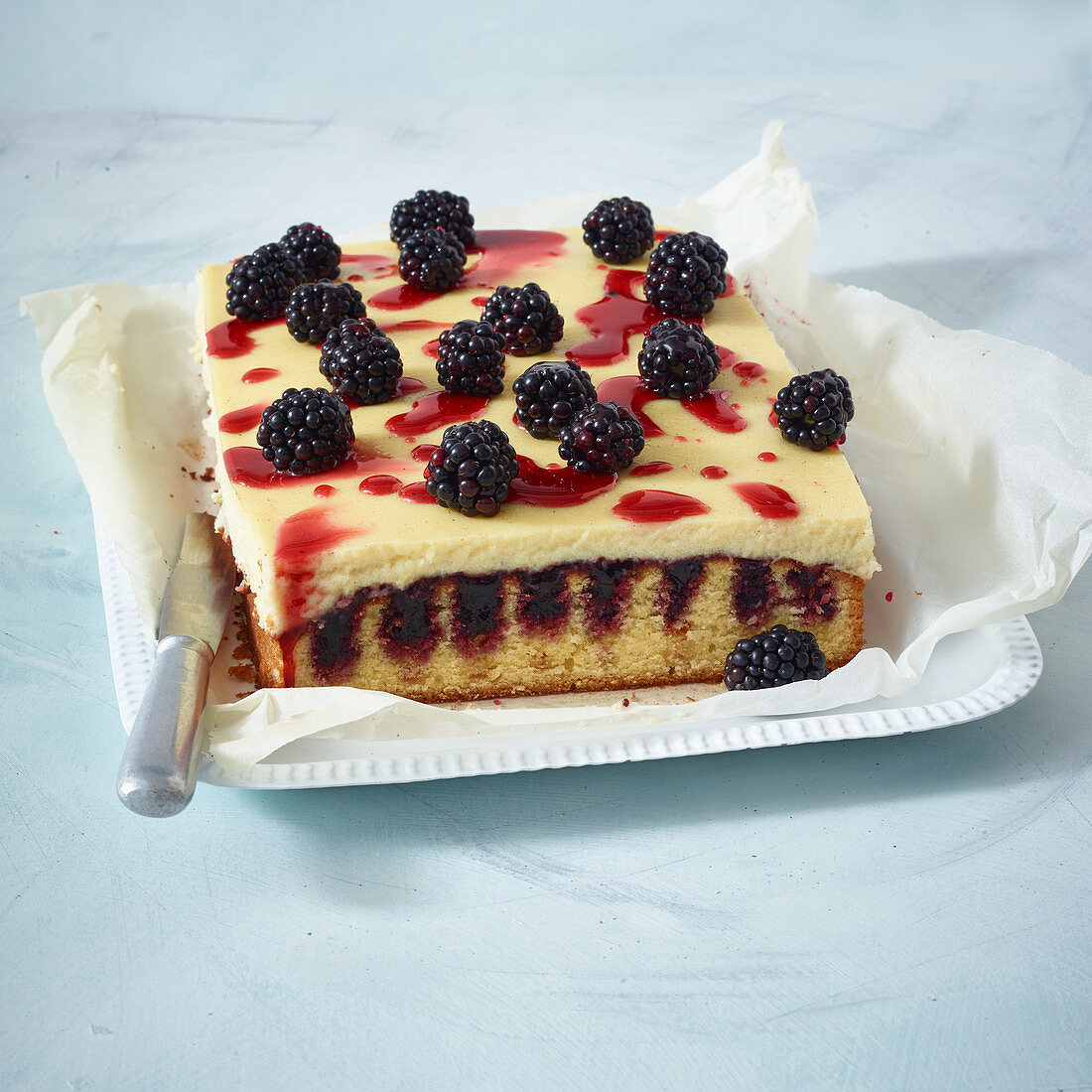 Blackberry and semolina pudding poke cake