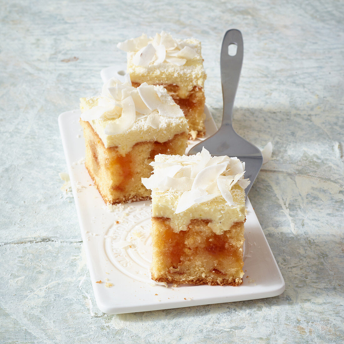 Coconut cream poke cake with apricot jam