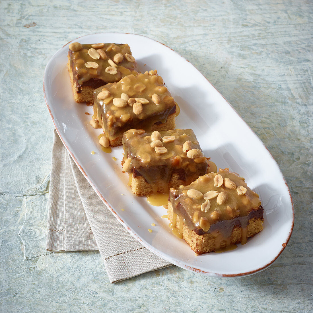 Peanut and toffe poke cake with coconut cream pudding