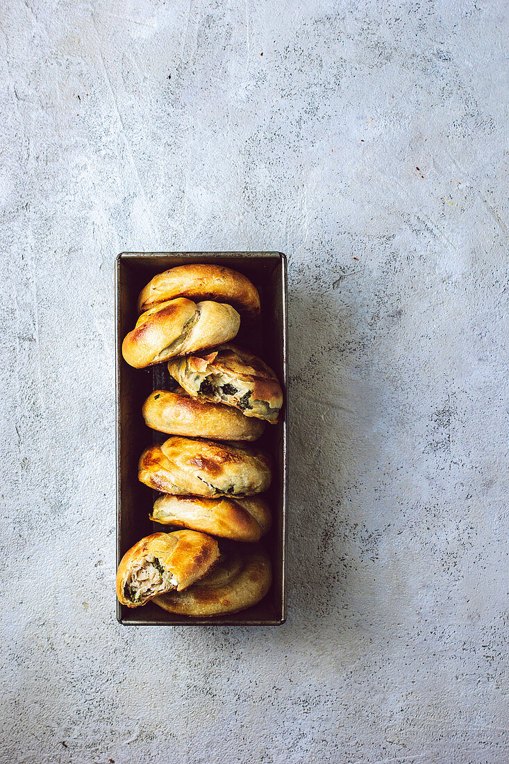 Greek handpies made of phyllo pastry, filled with feta and spinach