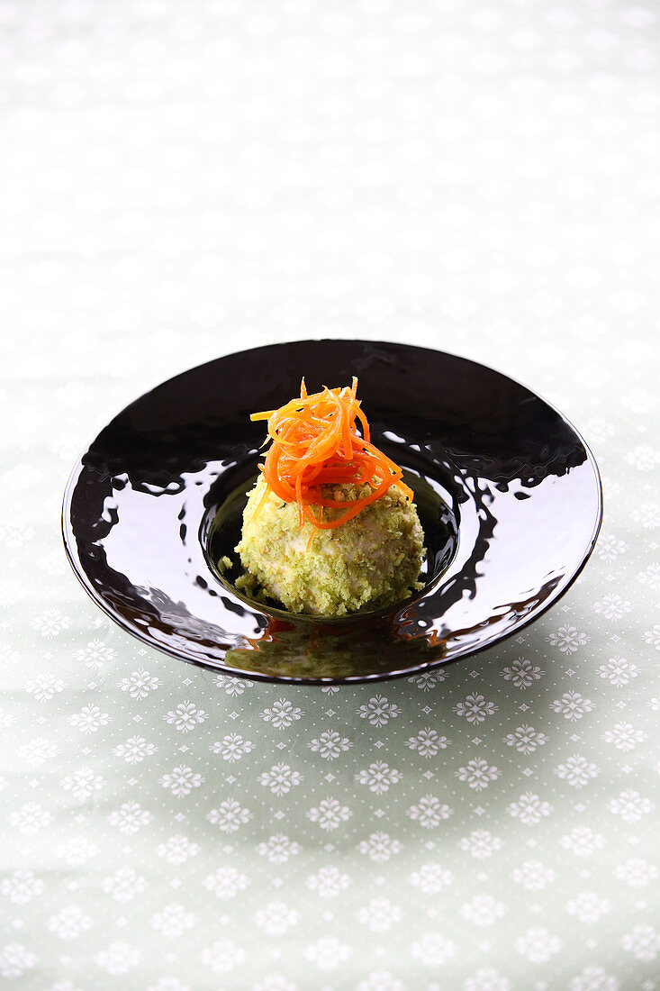 A 'camouflaged' matcha dumpling topped with grated carrots