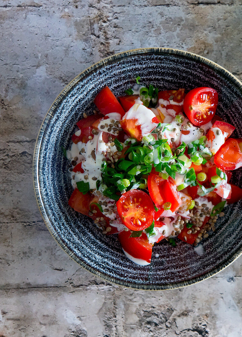 Tomato salad with spring onions and yoghurt