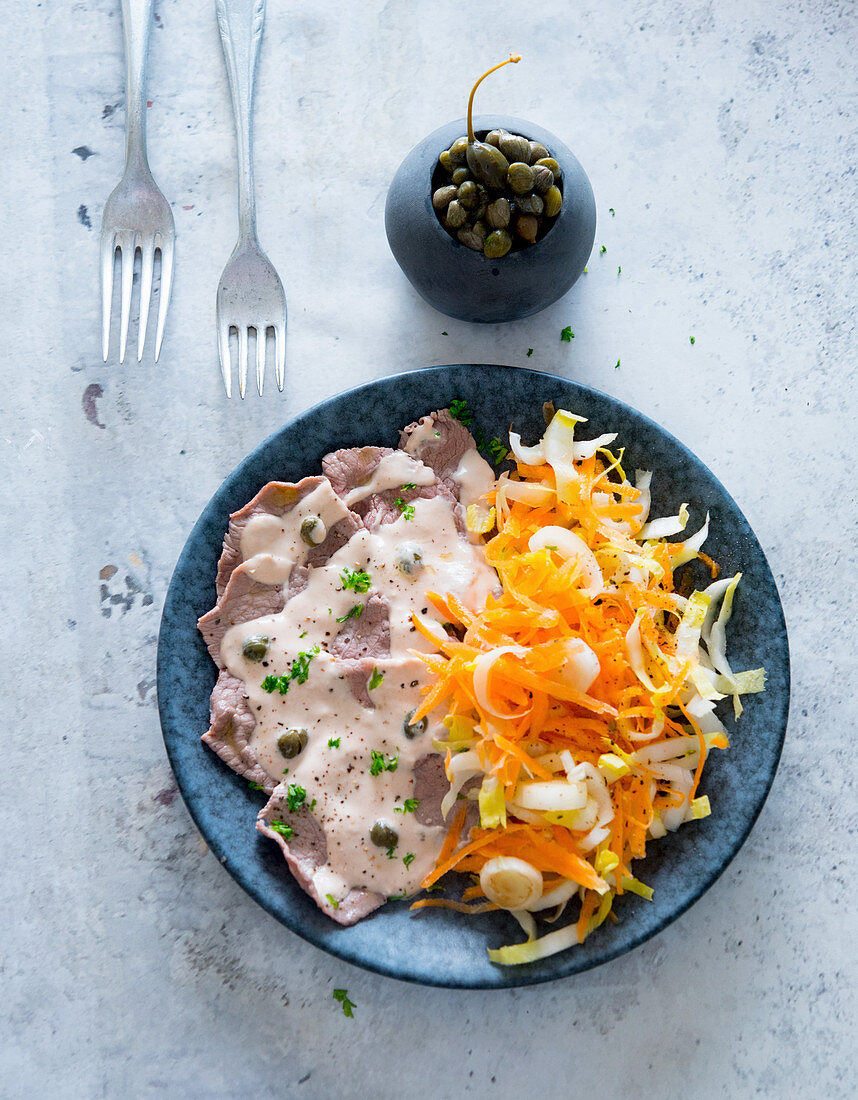 Vitello tonnato with a carrot and chicory salad