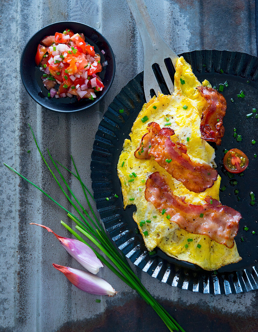 Omelette with bacon and tomato salsa