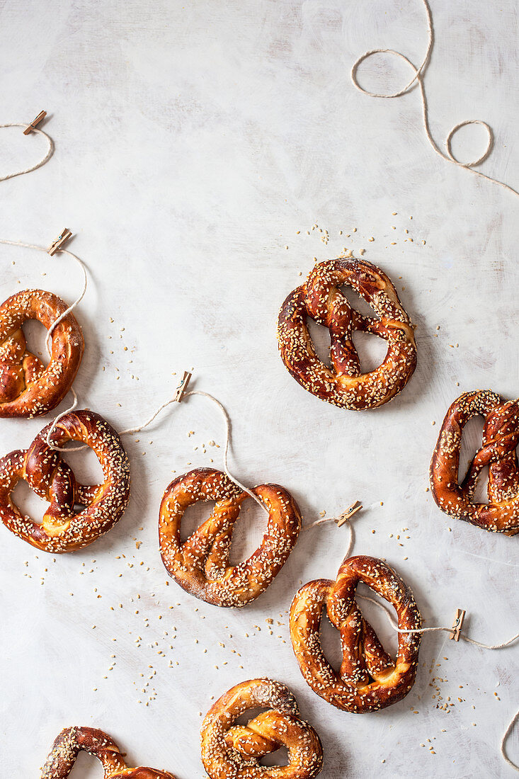 Homemade pretzels with seasme seeds on a string