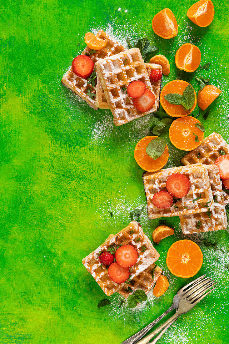 Waffles with strawberries and oranges