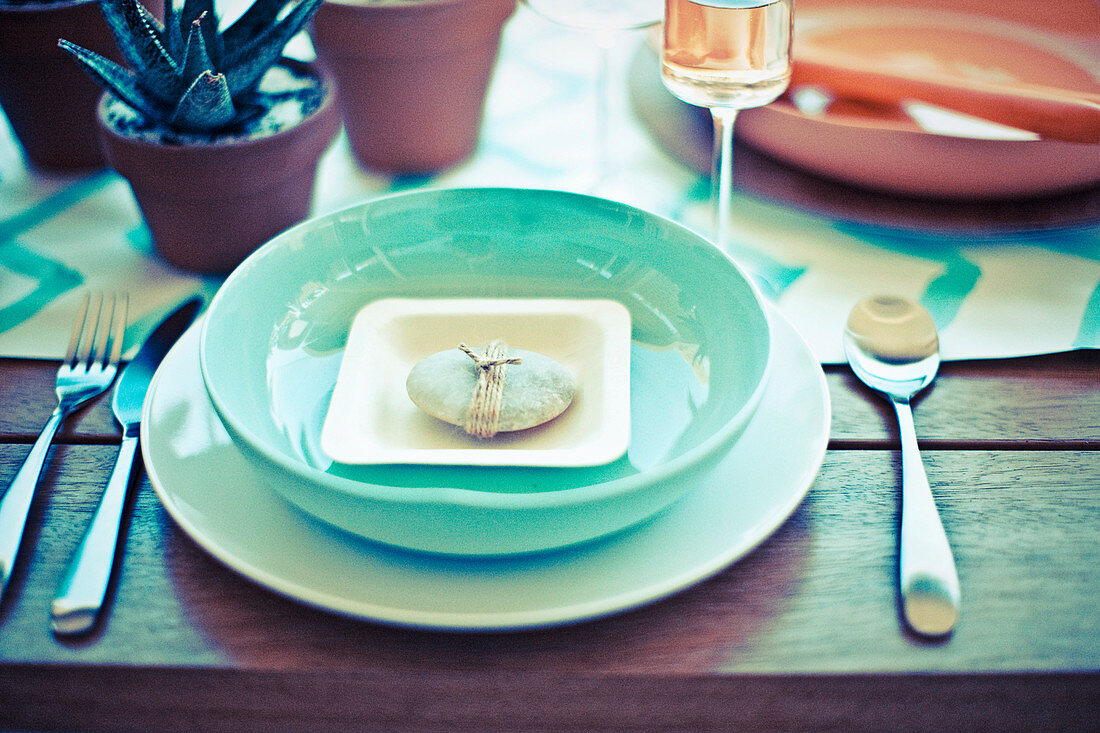 Turquoise place setting with a decorative stone